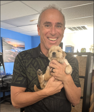 Image of Dr. Pete with puppy