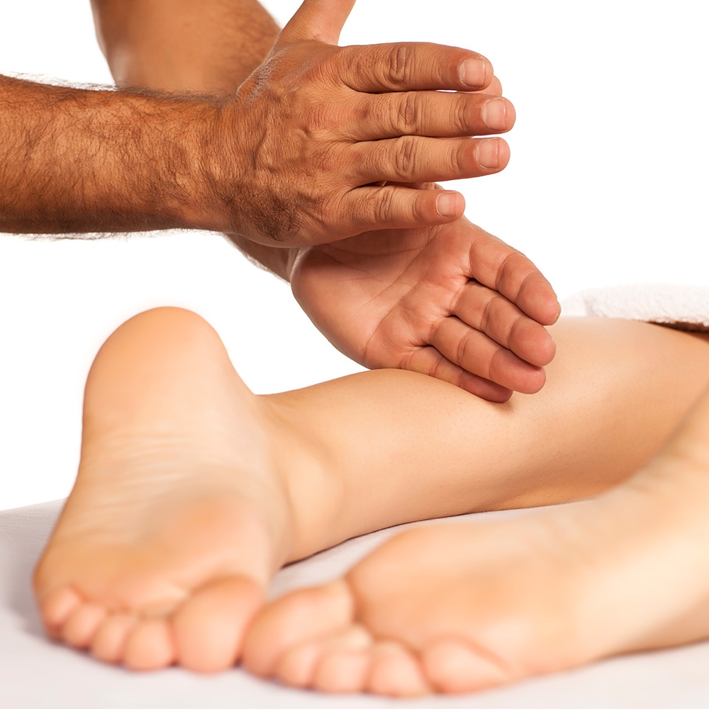 Leg massage with therapist using tapping techniques