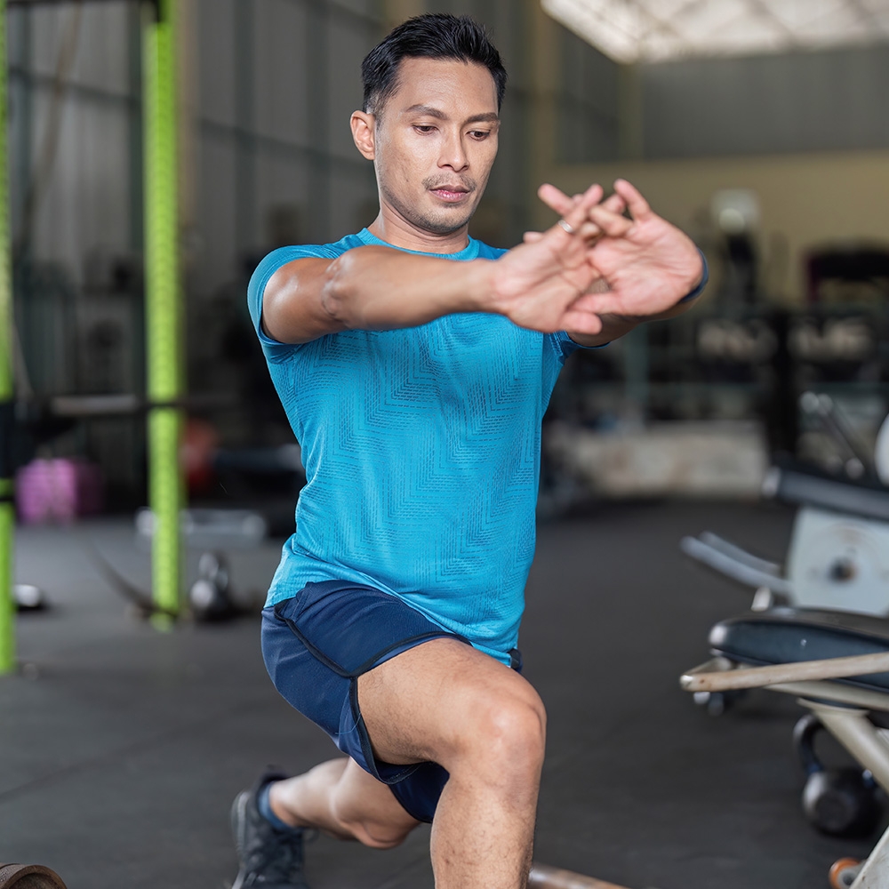 Man doing lunge stretches